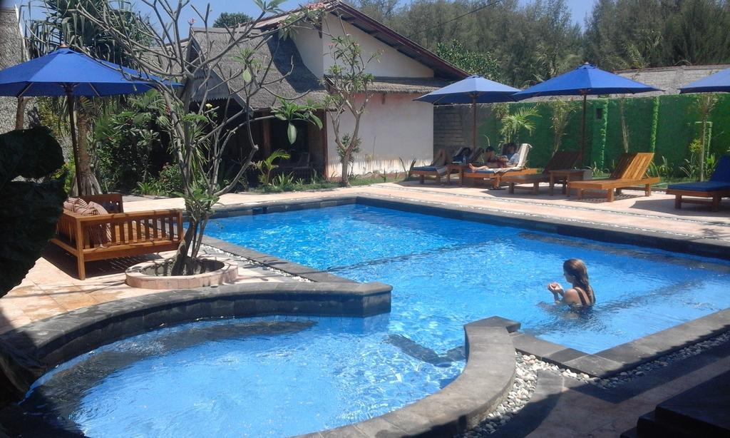 Coral Beach Pizza Cottages กีลีตราวางัน ภายนอก รูปภาพ