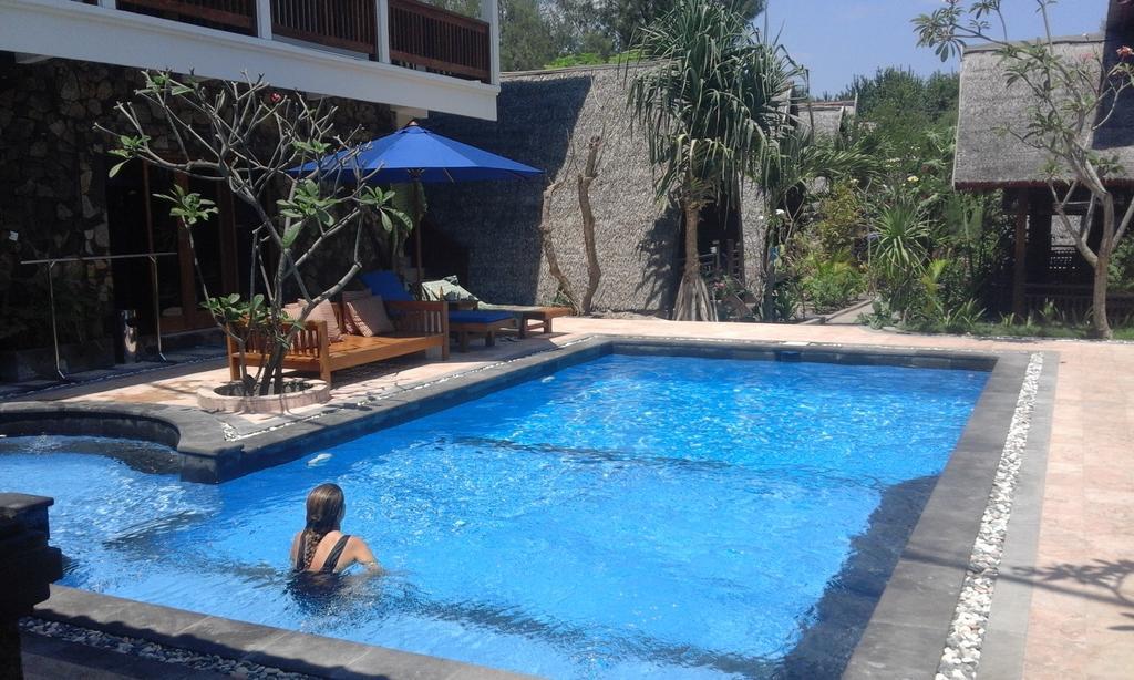 Coral Beach Pizza Cottages กีลีตราวางัน ภายนอก รูปภาพ