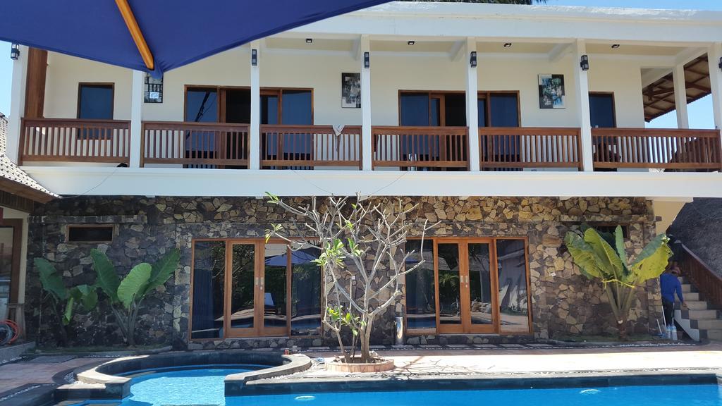 Coral Beach Pizza Cottages กีลีตราวางัน ภายนอก รูปภาพ