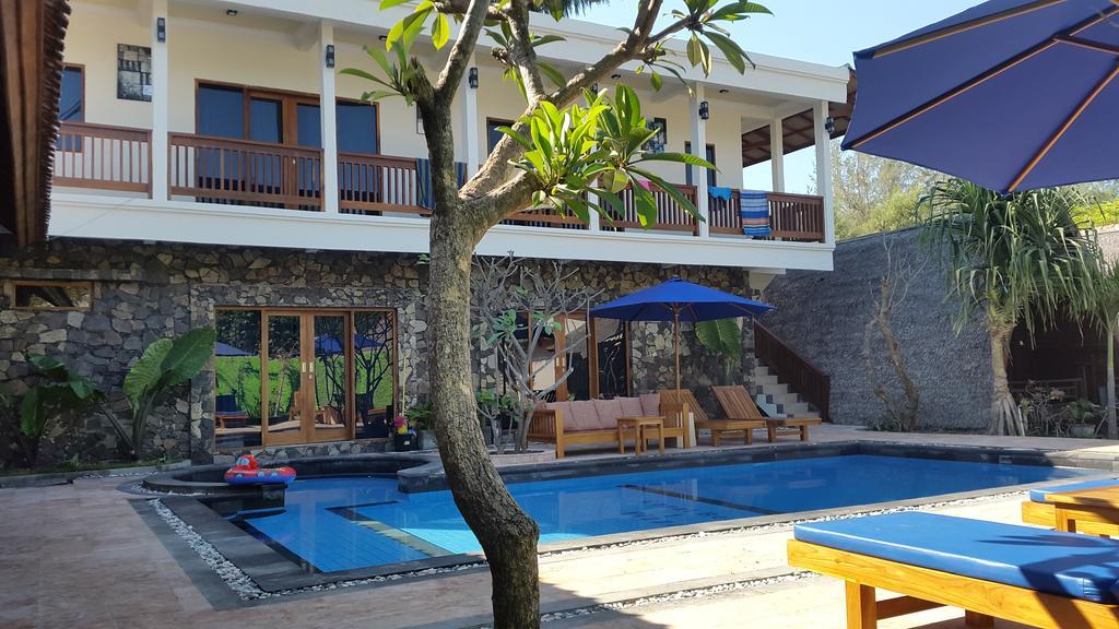 Coral Beach Pizza Cottages กีลีตราวางัน ภายนอก รูปภาพ