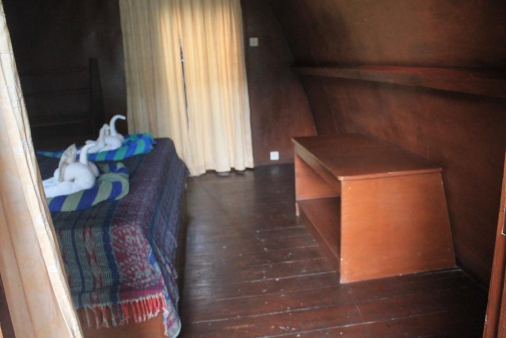 Coral Beach Pizza Cottages กีลีตราวางัน ภายนอก รูปภาพ
